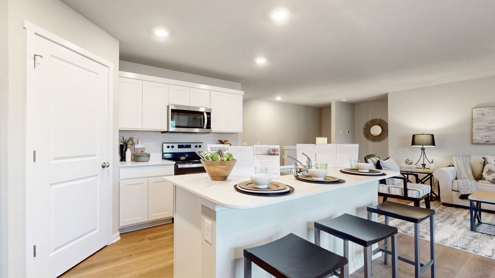 Kitchen with white cabinetry and quartz countertop