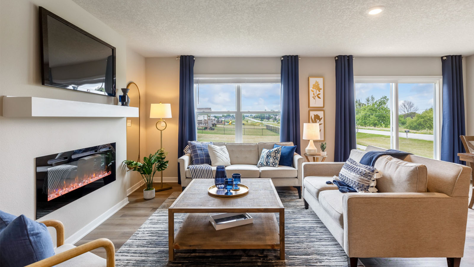 Open concept living room with electric fireplace