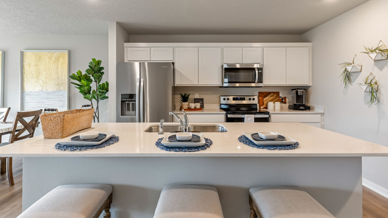 Kitchen with white cabinetry and quartz countertop