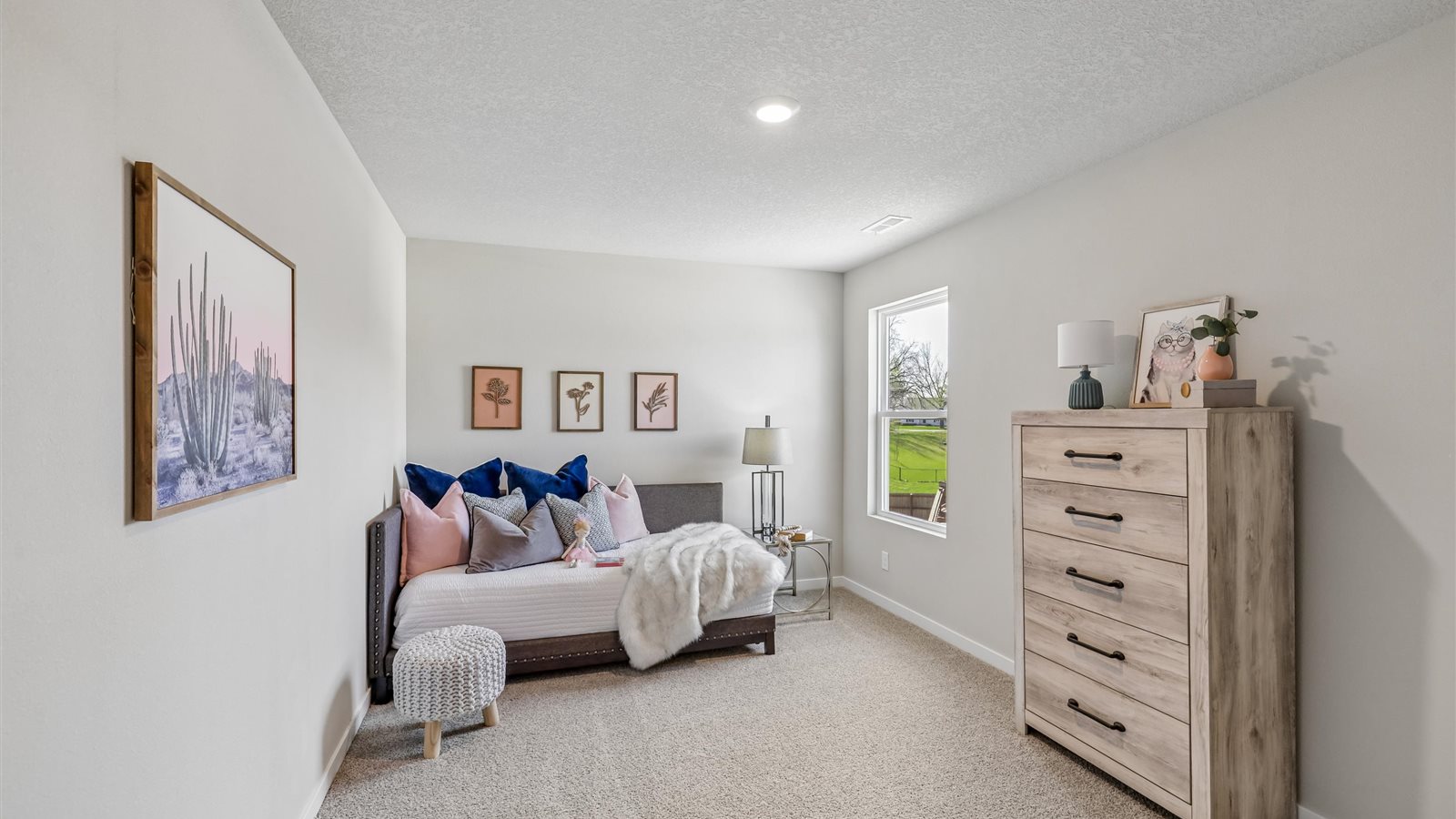 Comfortable secondary bedroom with natural light, modern finishes, and versatile living space.