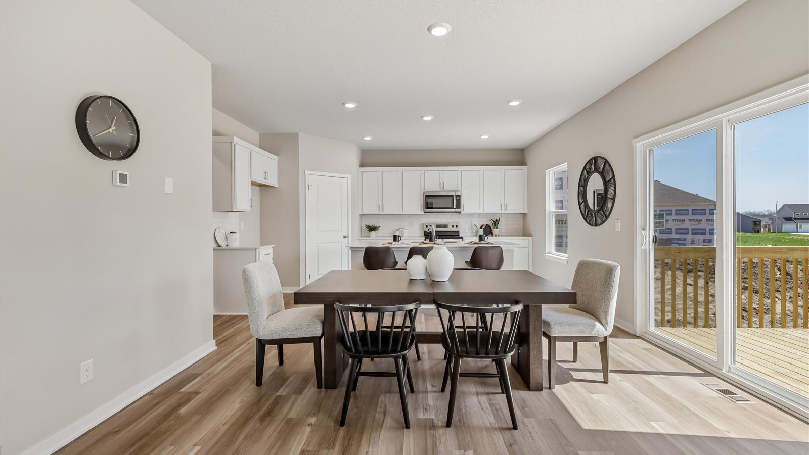 Open concept dining space with access to backyard