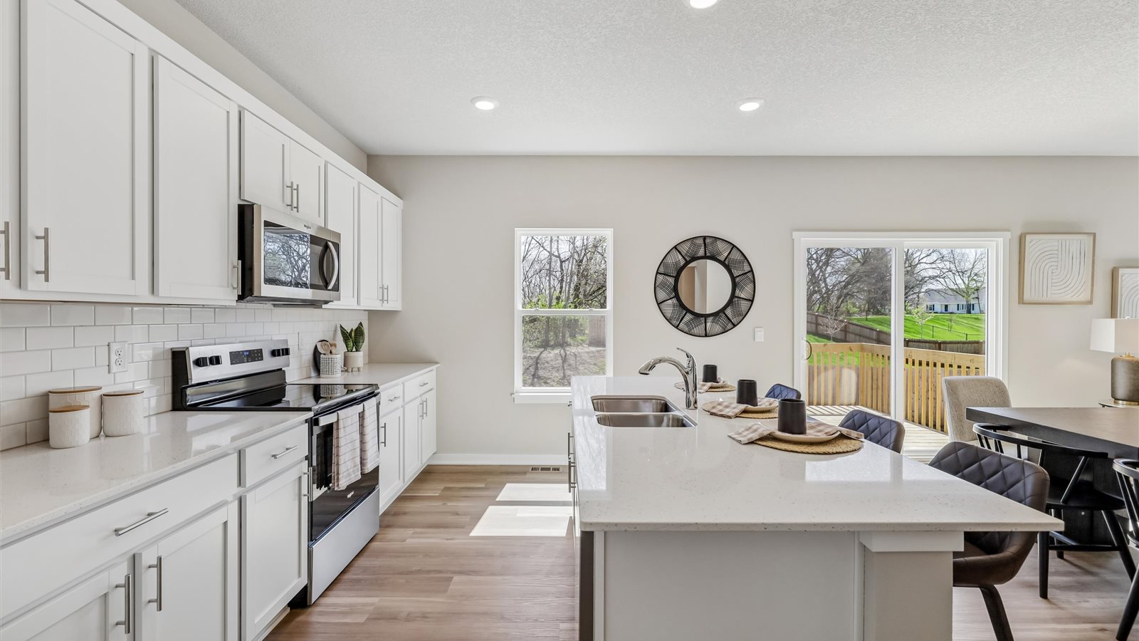 Kitchen with white cabinetry and quartz countertop