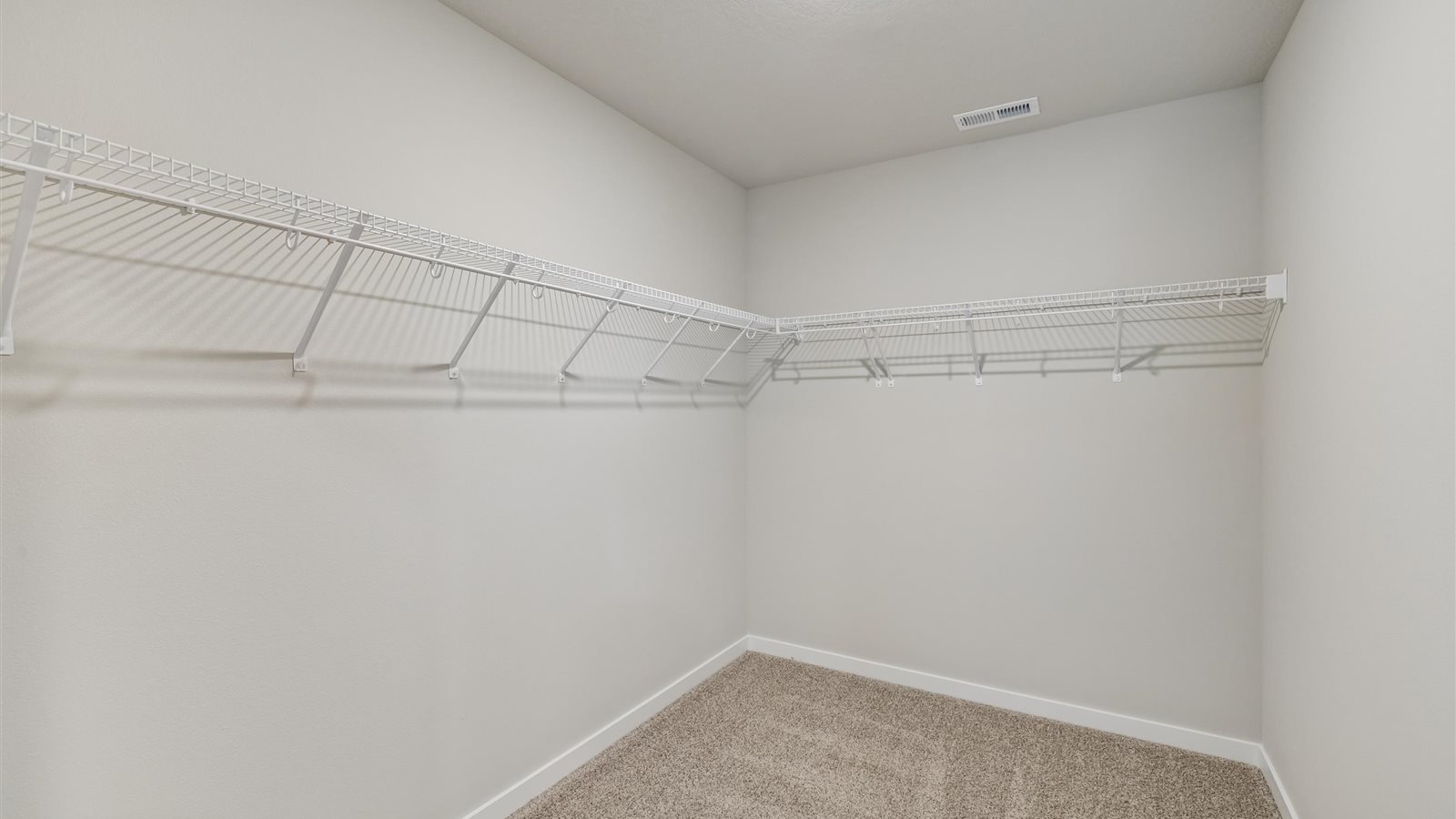 Spacious walk-in closet offering ample room for clothing, accessories, and everyday essentials.