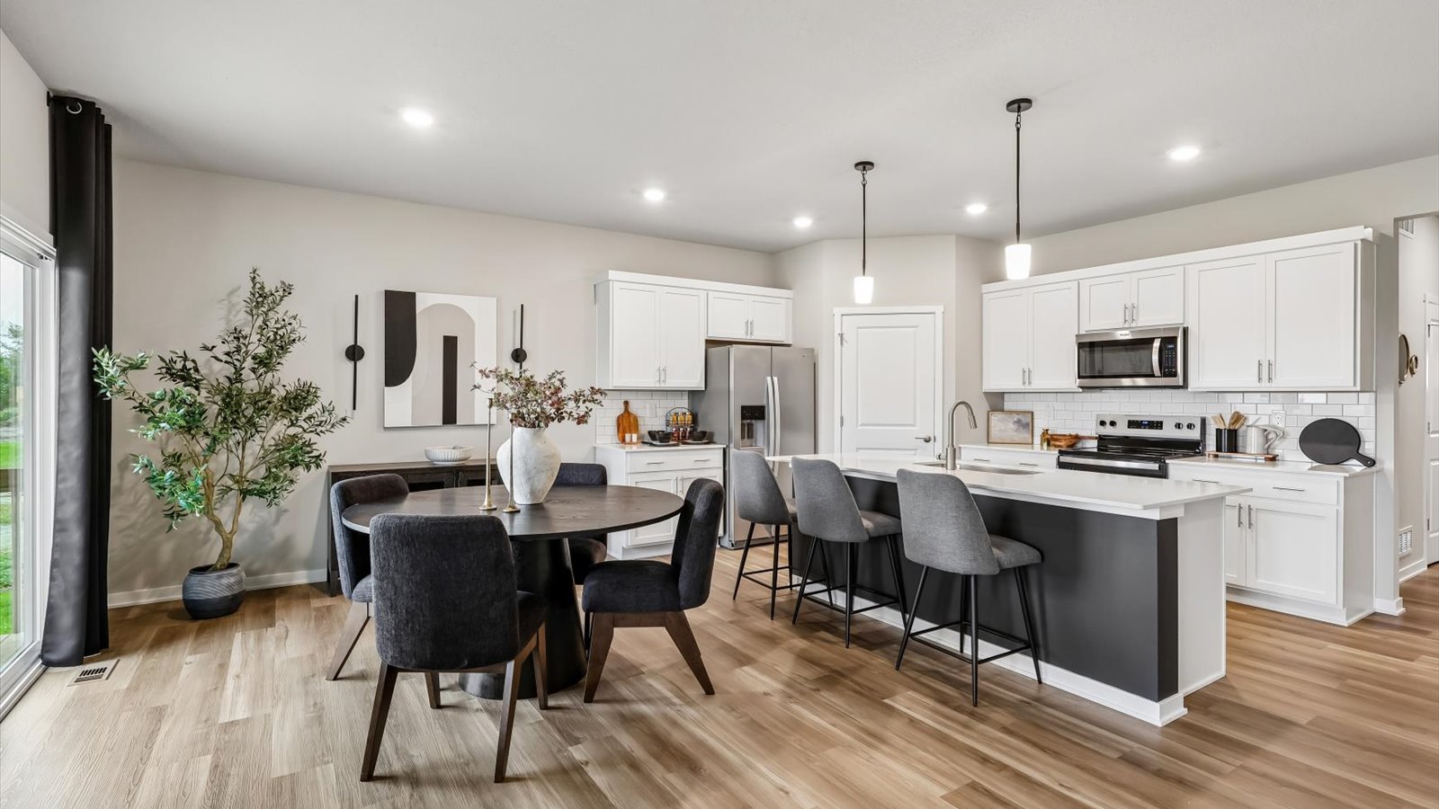 Kitchen with white cabinetry and quartz countertop