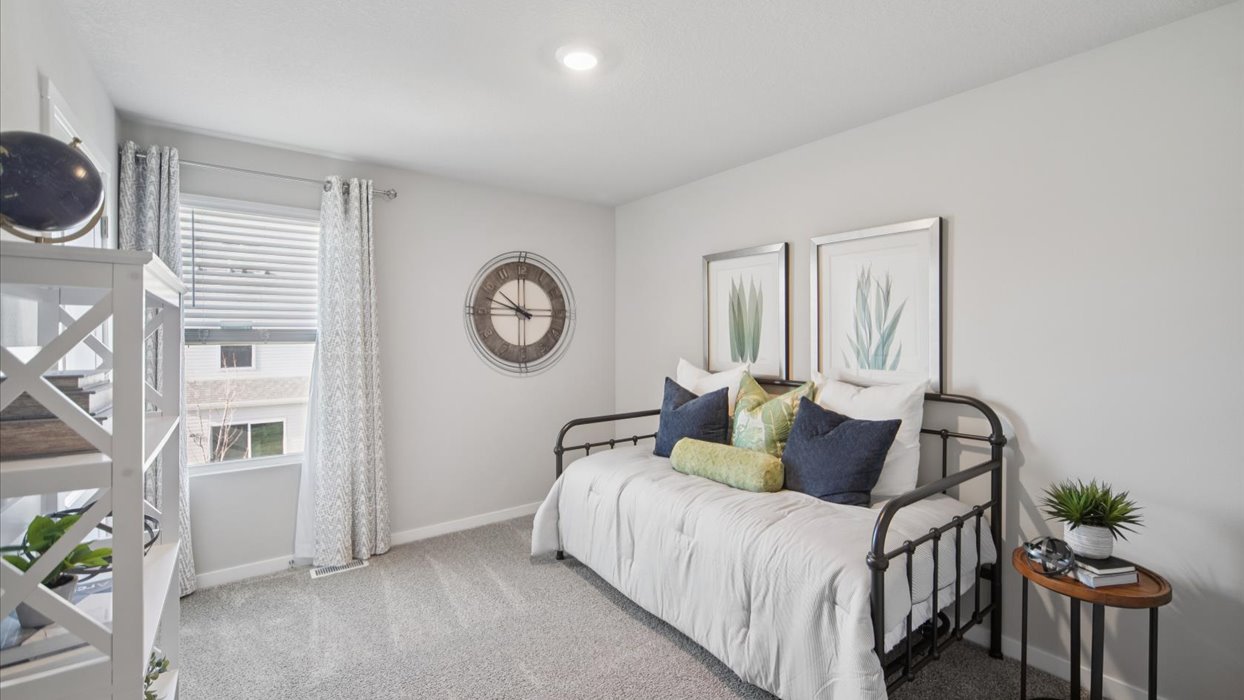 Comfortable secondary bedroom with natural light, modern finishes, and versatile living space.