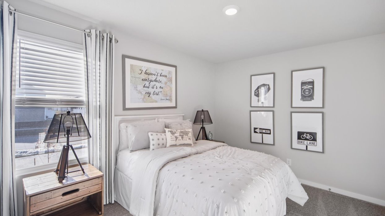 Comfortable secondary bedroom with natural light, modern finishes, and versatile living space.
