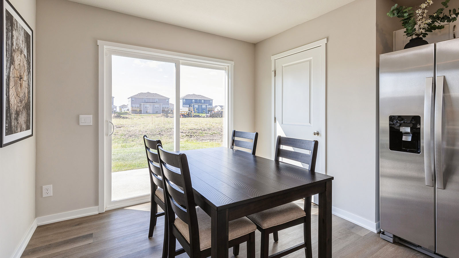 Open concept dining space with access to backyard