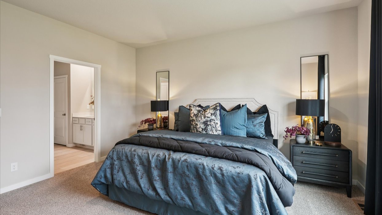 Primary bedroom with natural lighting and spacious layout