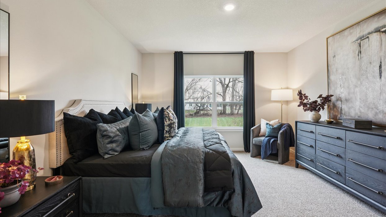 Primary bedroom with natural lighting and spacious layout