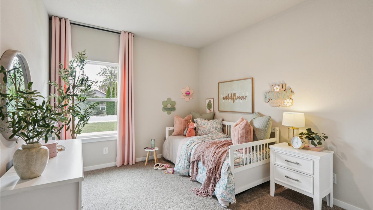 Comfortable secondary bedroom with natural light, modern finishes, and versatile living space.