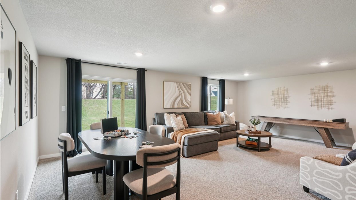 Finished basement living area with comfortable seating space and flexible room for entertaining or relaxing.