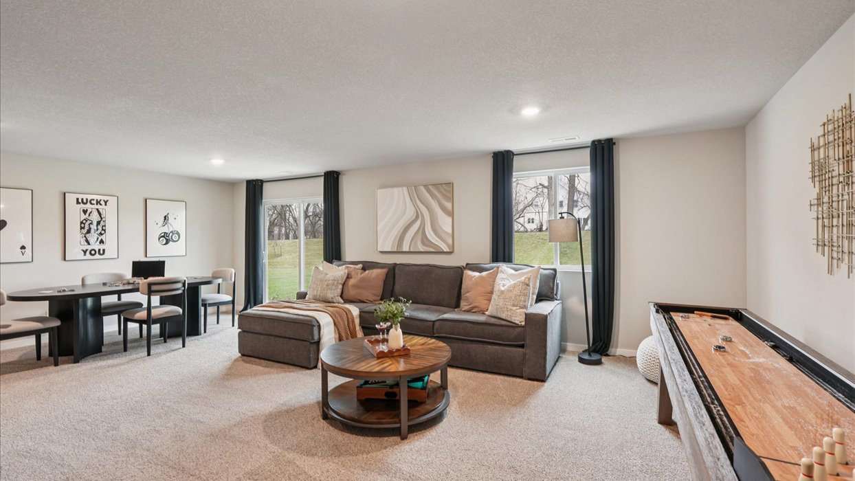 Finished basement living area with comfortable seating space and flexible room for entertaining or relaxing.