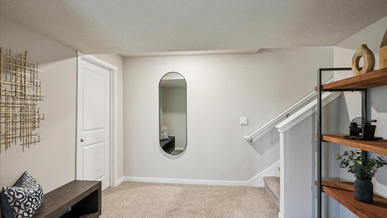 Finished basement living area with comfortable seating space and flexible room for entertaining or relaxing.