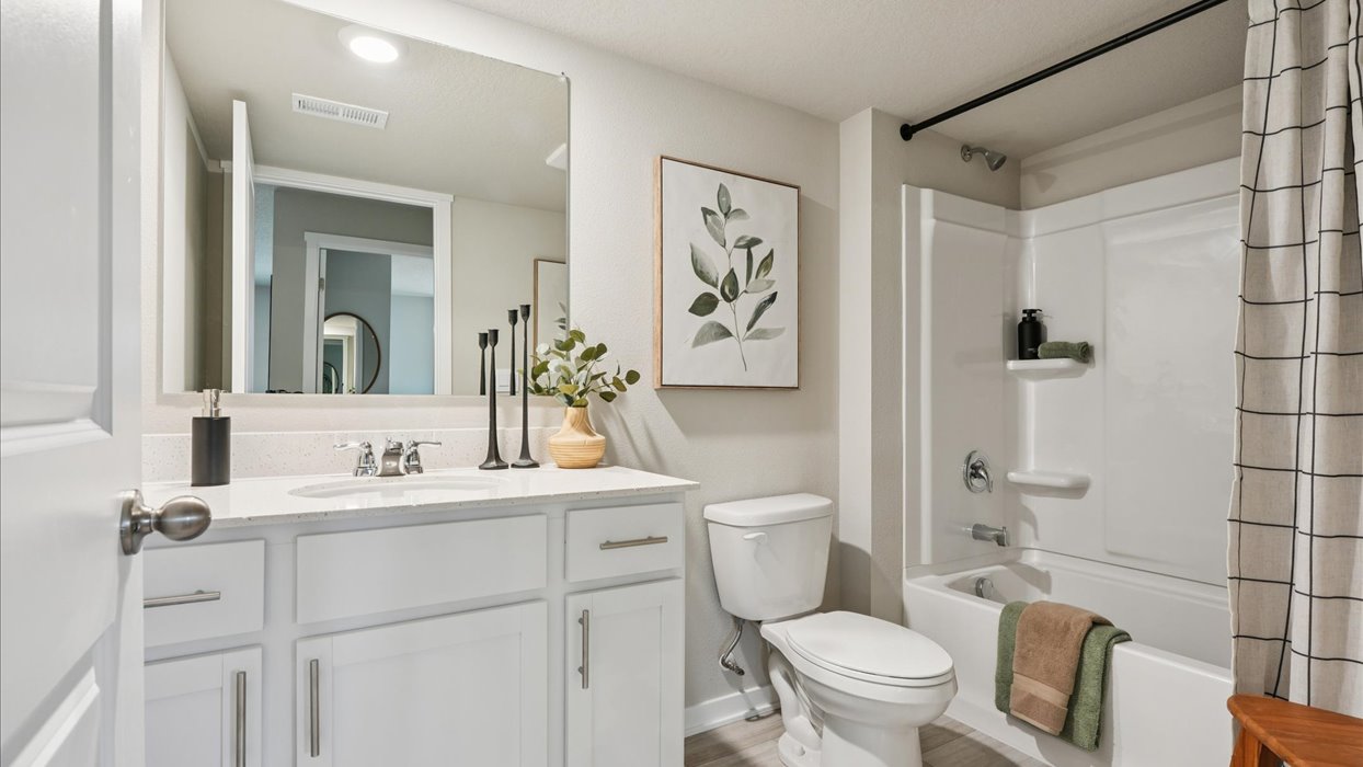 Stylish lower-level bathroom featuring contemporary fixtures and convenient access from the finished basement.