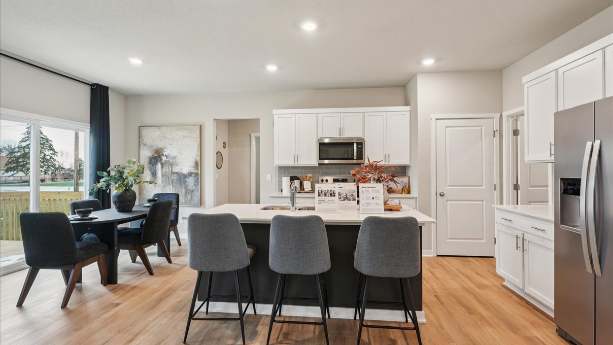 Kitchen with white cabinetry and quartz countertop