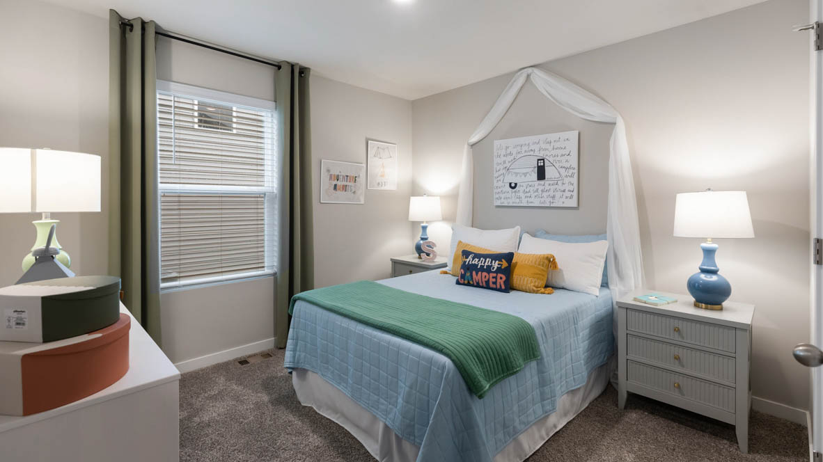 Comfortable secondary bedroom with natural light, modern finishes, and versatile living space.