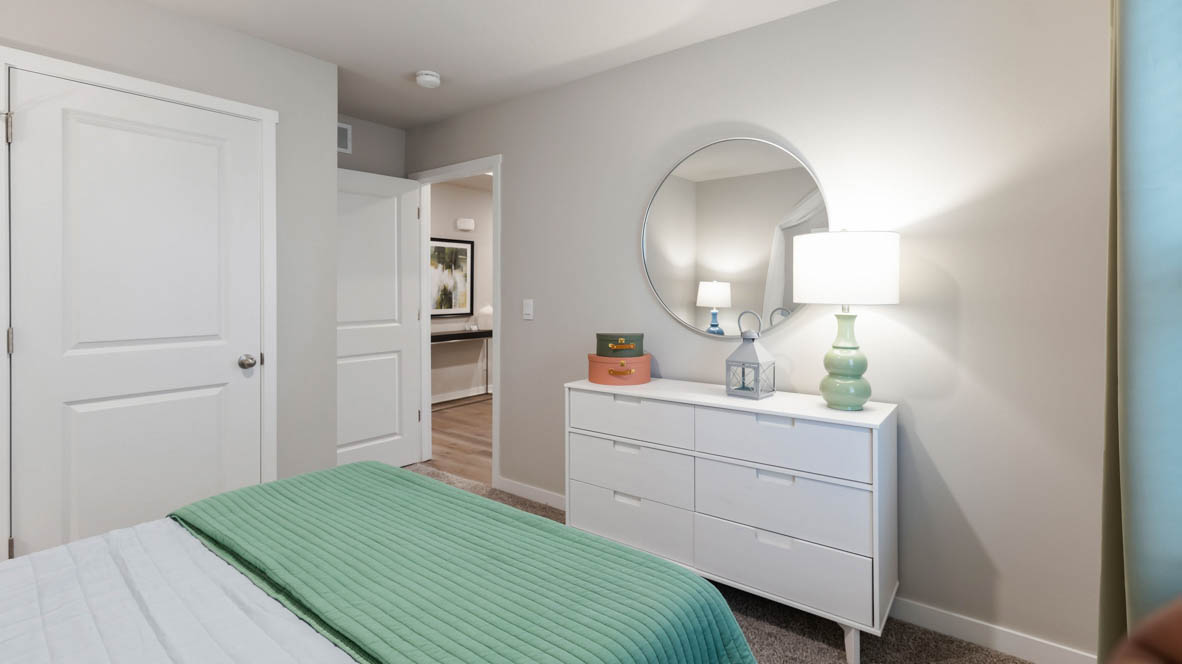 Comfortable secondary bedroom with natural light, modern finishes, and versatile living space.