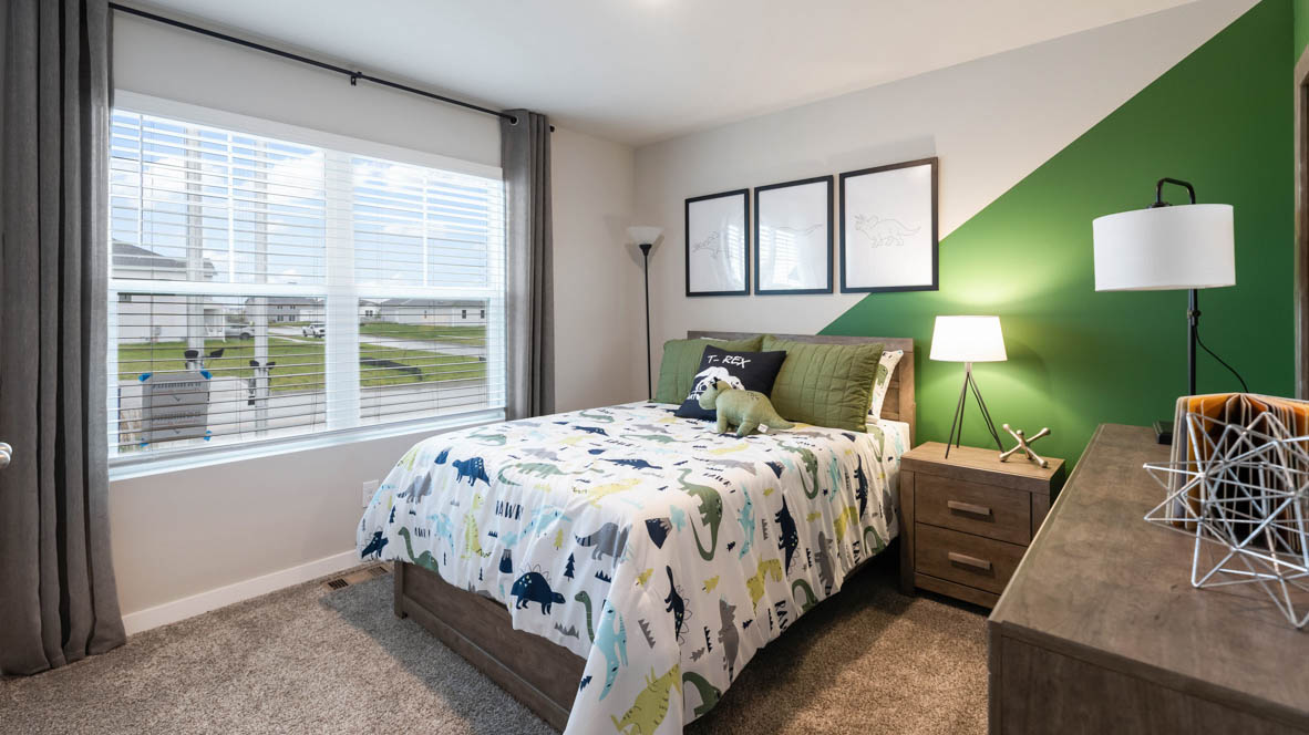 Comfortable secondary bedroom with natural light, modern finishes, and versatile living space.