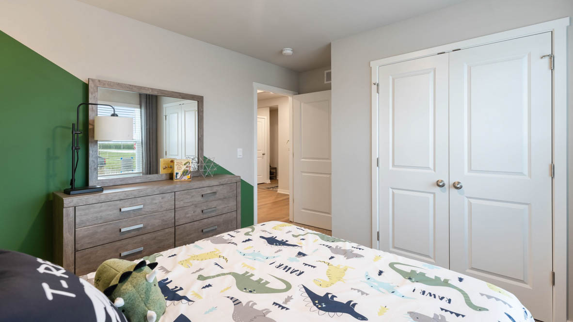 Comfortable secondary bedroom with natural light, modern finishes, and versatile living space.
