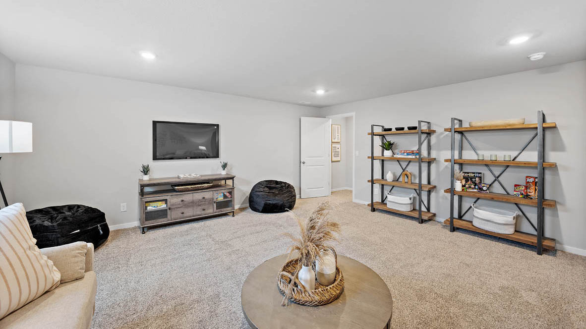 Finished basement living area with comfortable seating space and flexible room for entertaining or relaxing.