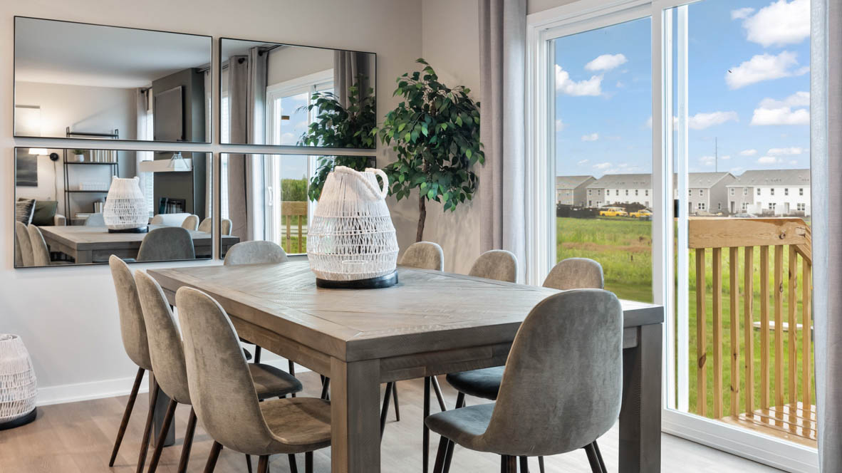 Open concept dining space with access to backyard