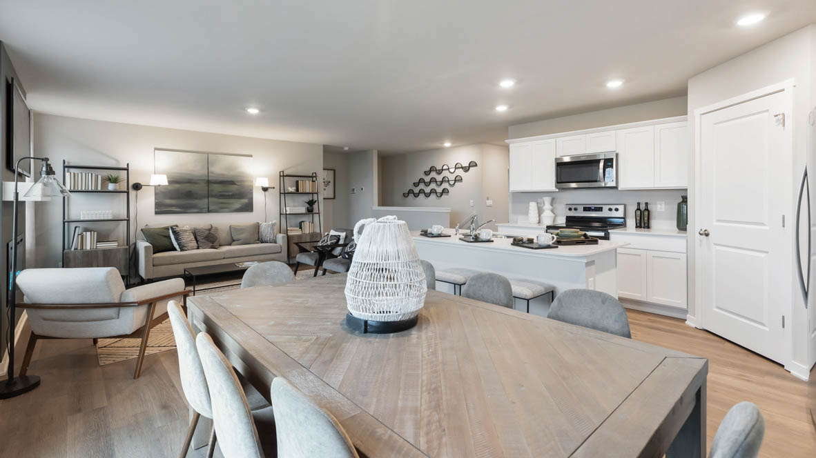 Open concept dining space with access to backyard