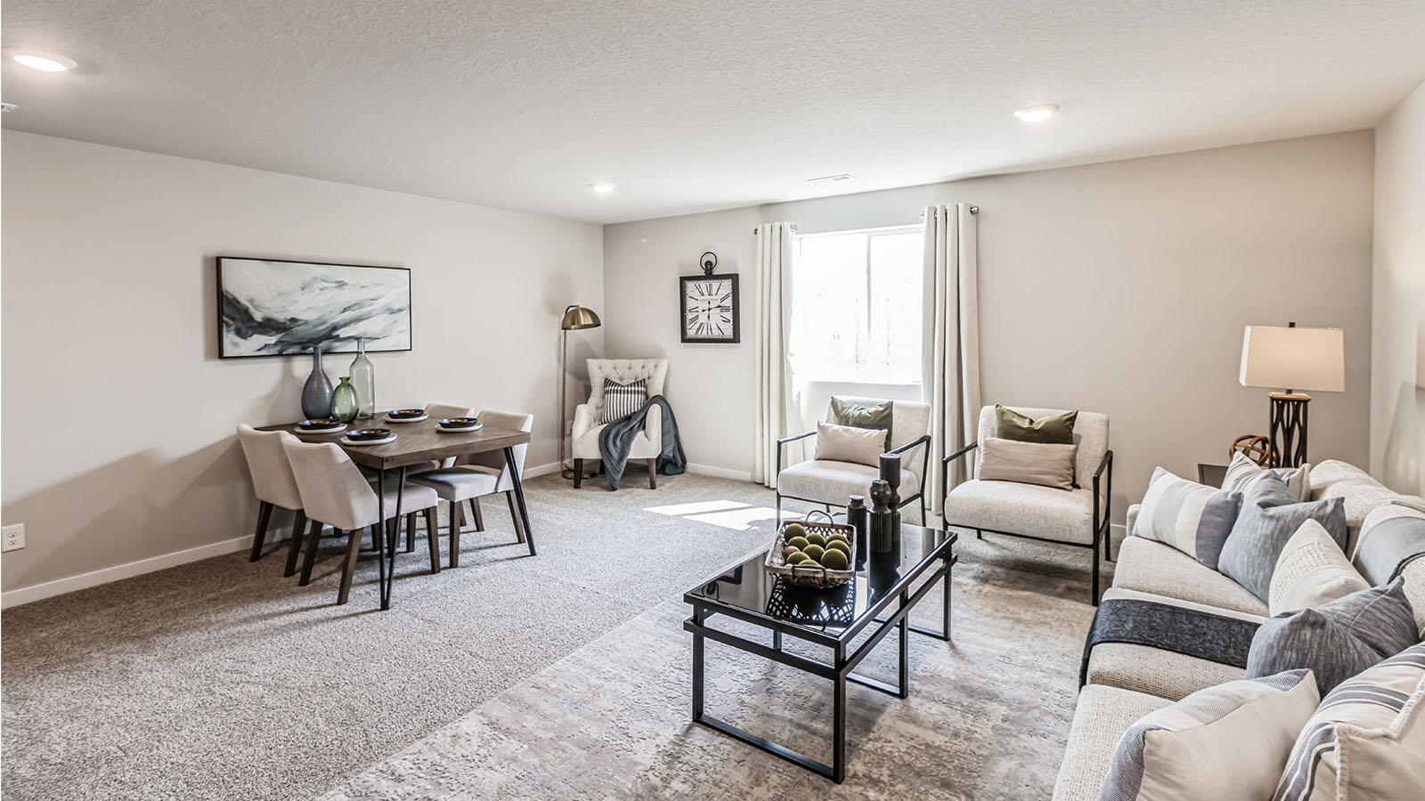 Finished basement living area with comfortable seating space and flexible room for entertaining or relaxing.