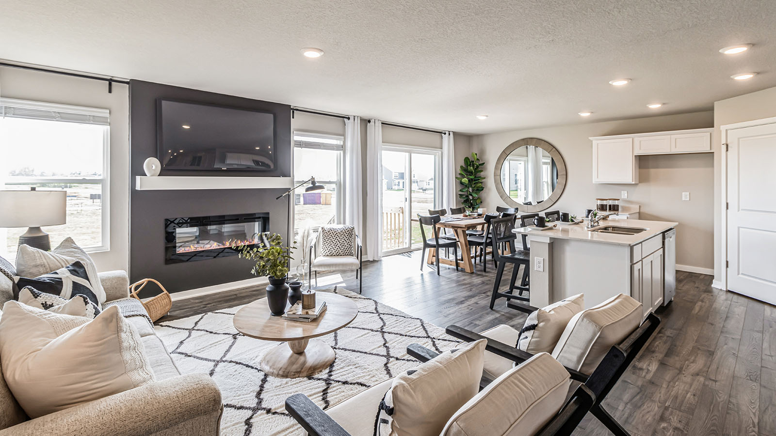 Open concept living room with electric fireplace
