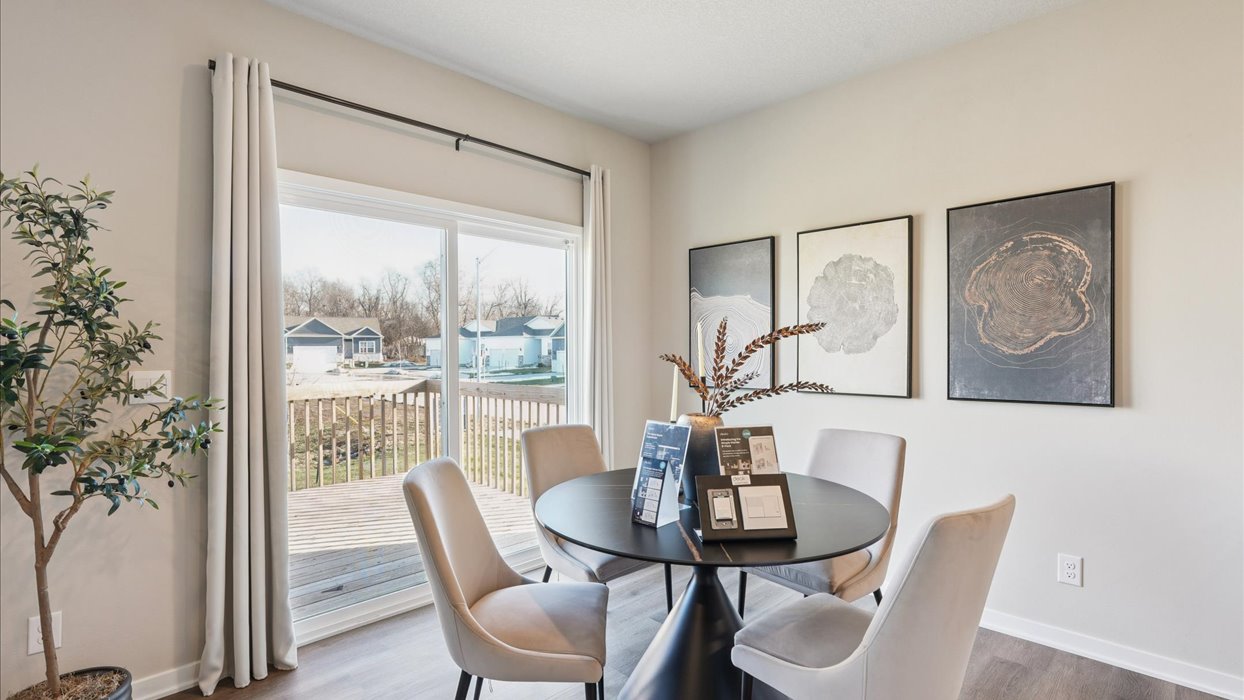 Open concept dining space with access to backyard