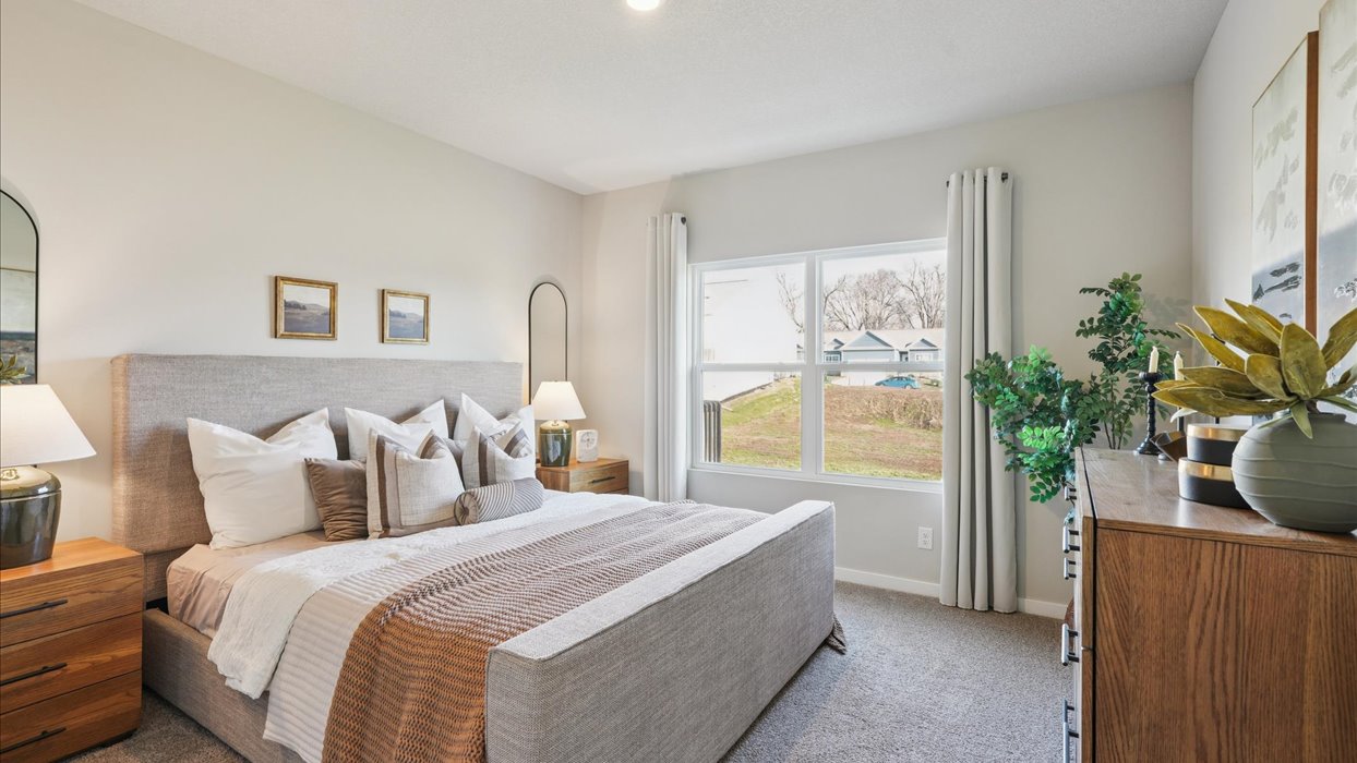 Primary bedroom with natural lighting and spacious layout