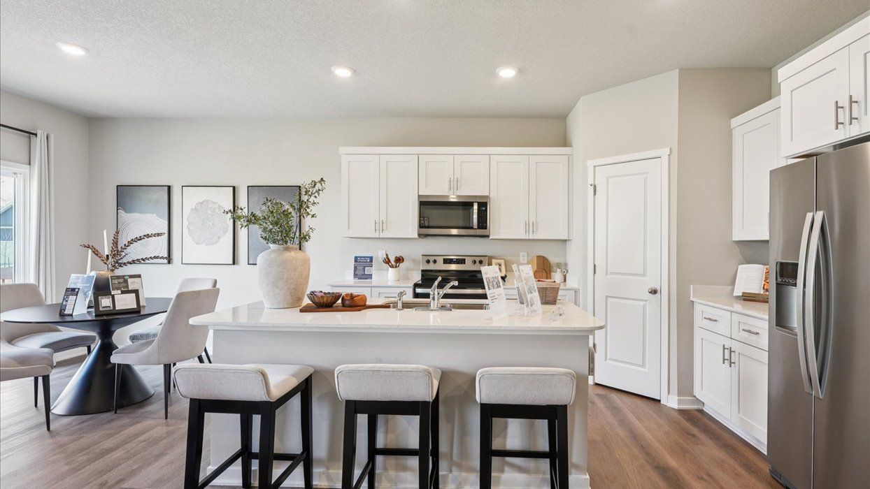 Kitchen with white cabinetry and quartz countertop
