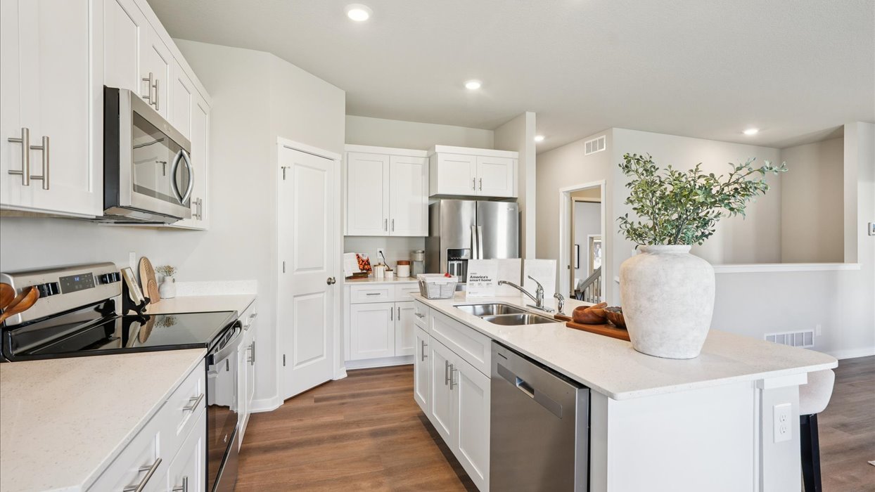 Kitchen with white cabinetry and quartz countertop
