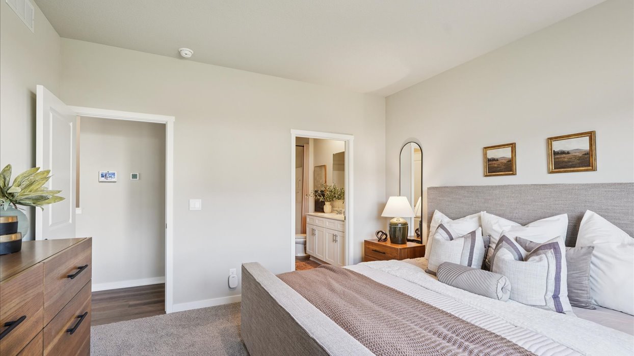 Primary bedroom with natural lighting and spacious layout