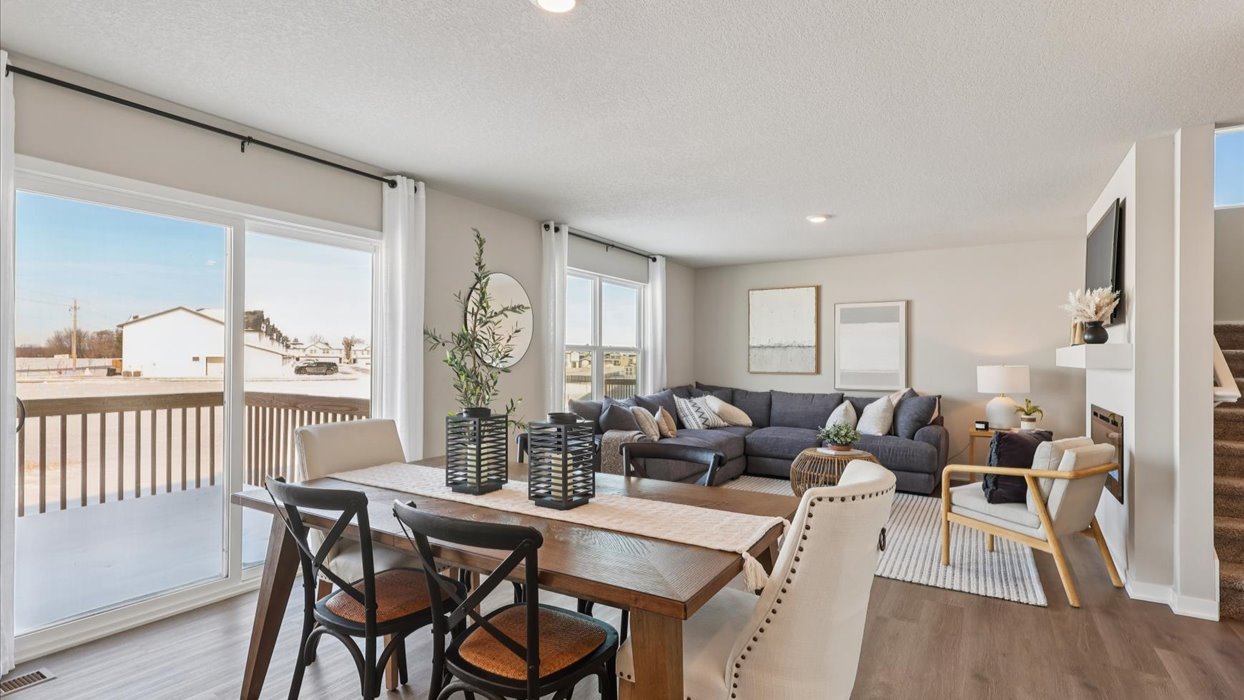 dining area with wood table overlooking living room