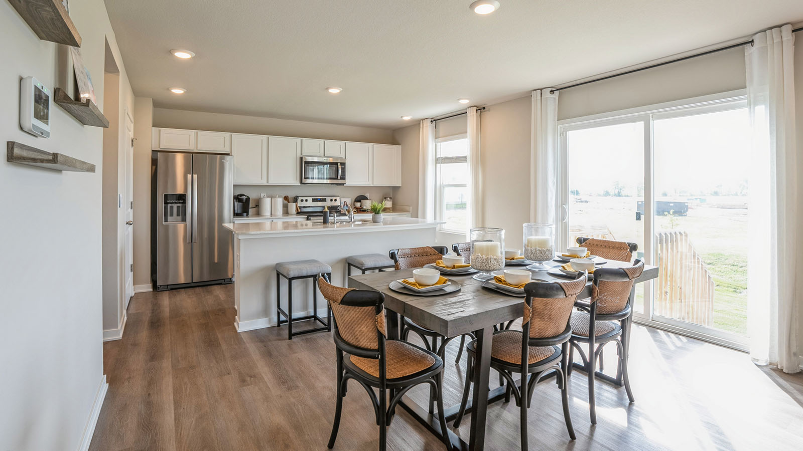 Open concept dining space with access to backyard