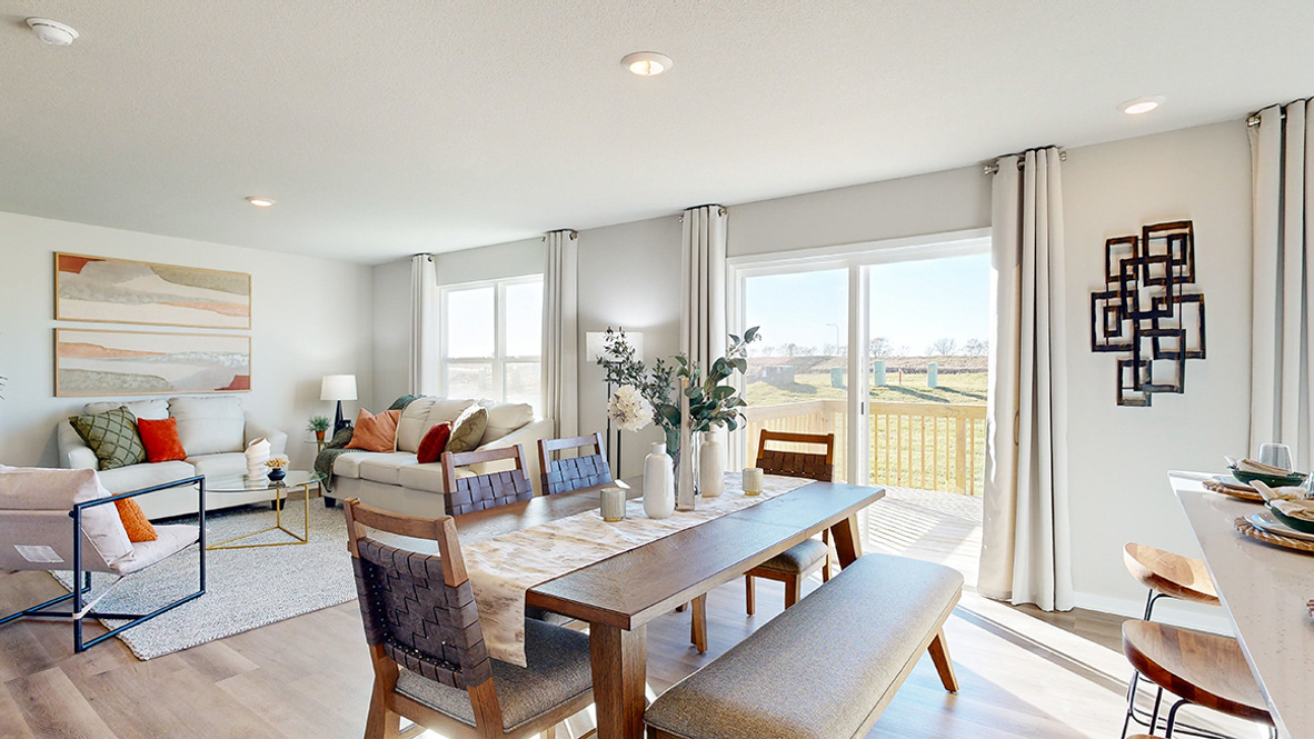 Open concept dining space with access to backyard
