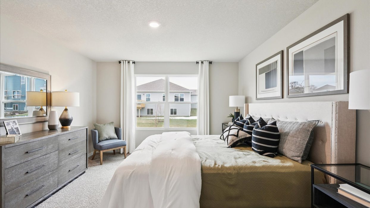 Primary bedroom with natural lighting and spacious layout