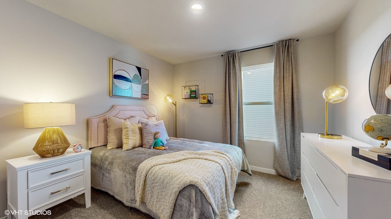 Comfortable secondary bedroom with natural light, modern finishes, and versatile living space.