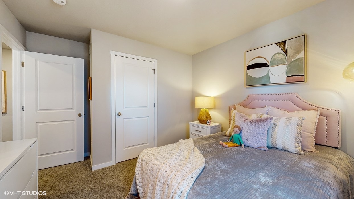 Comfortable secondary bedroom with natural light, modern finishes, and versatile living space.