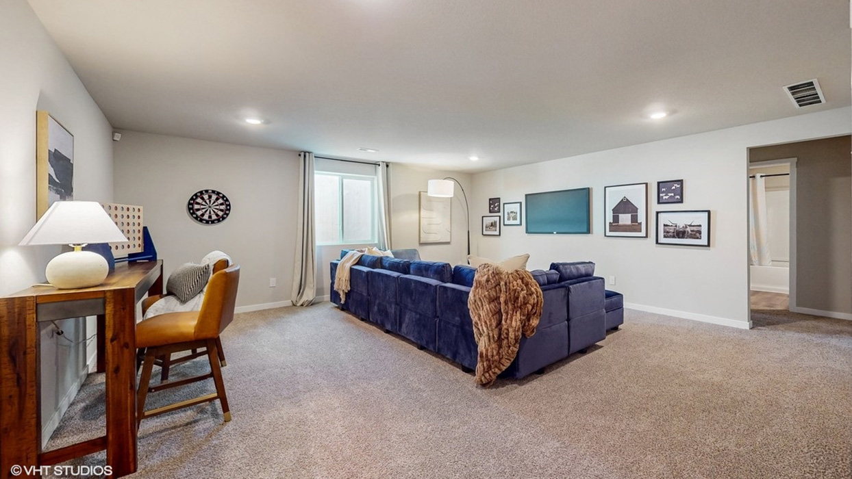 Finished basement living area with comfortable seating space and flexible room for entertaining or relaxing.