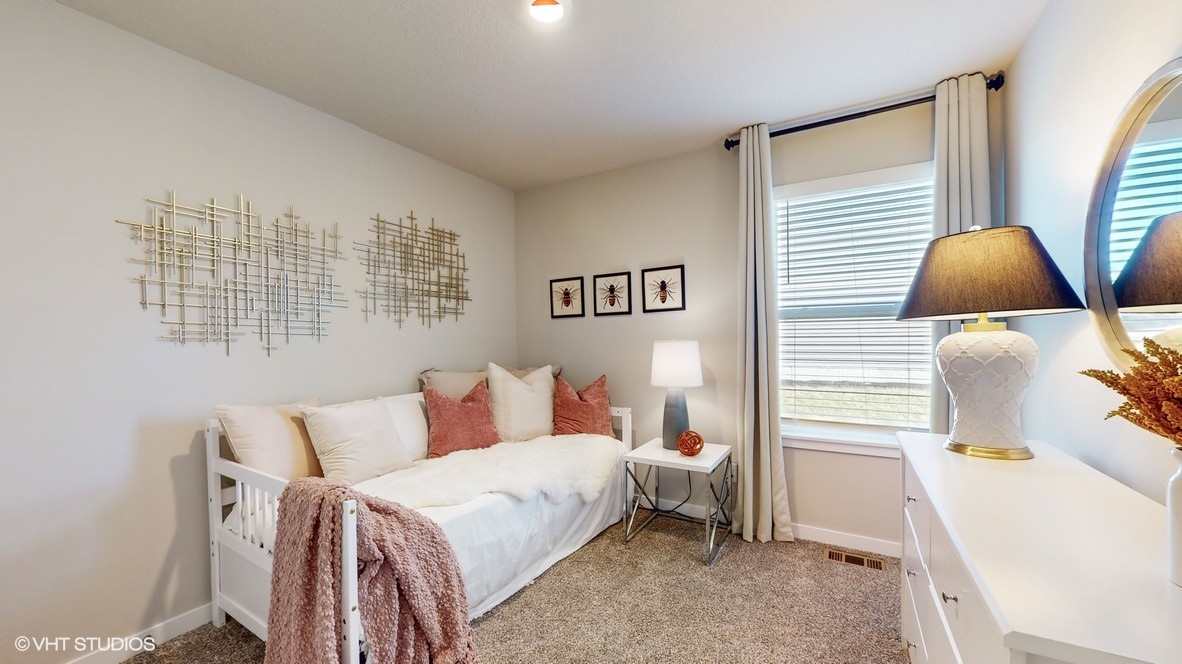 Comfortable secondary bedroom with natural light, modern finishes, and versatile living space.