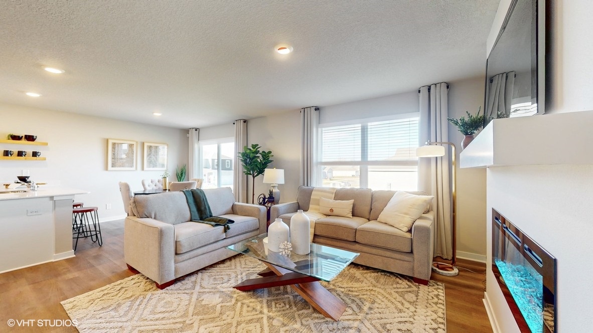 Open concept living room with electric fireplace