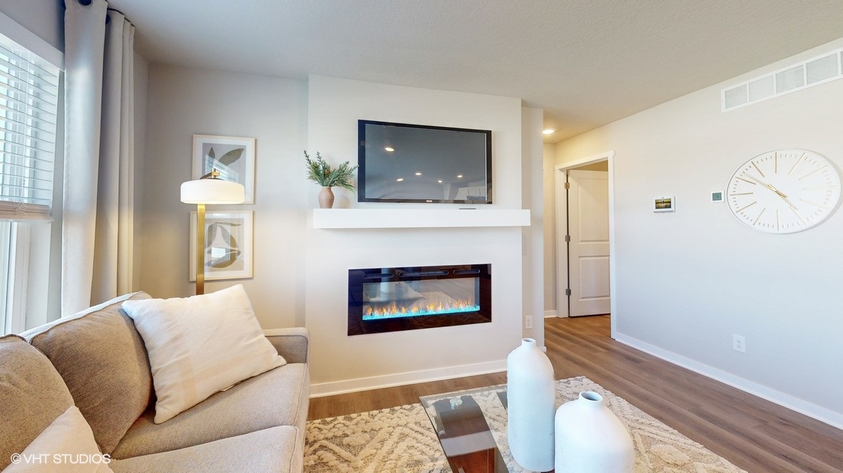 Open concept living room with electric fireplace
