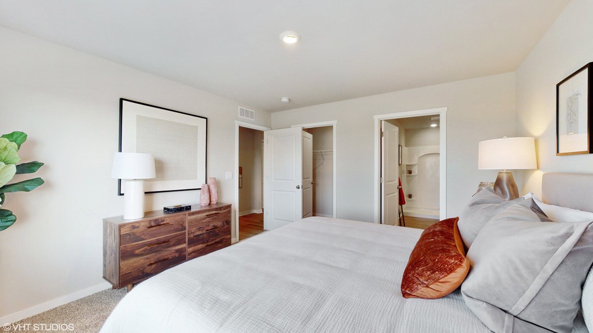 Primary bedroom with natural lighting and spacious layout