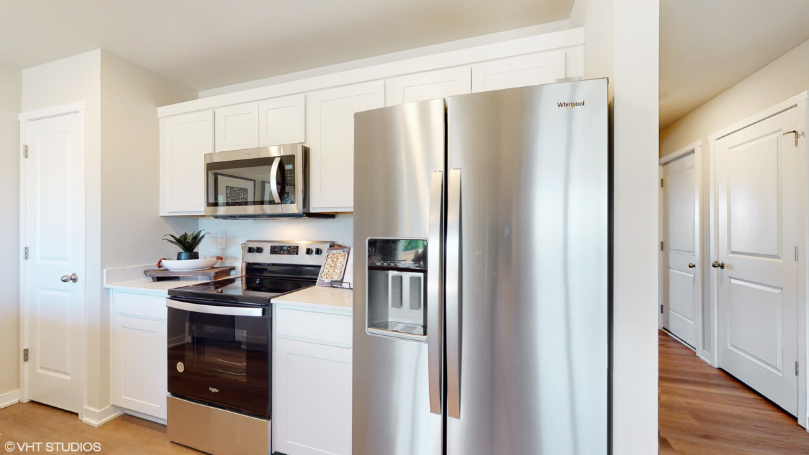 Kitchen with white cabinetry and quartz countertop