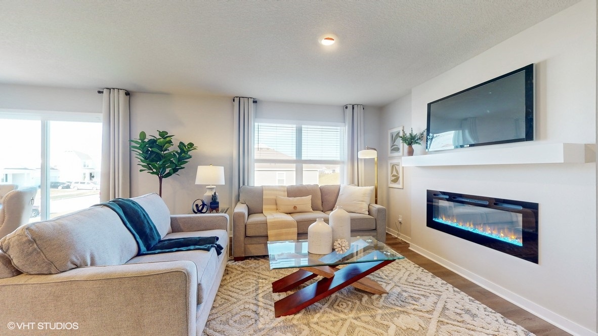 Open concept living room with electric fireplace