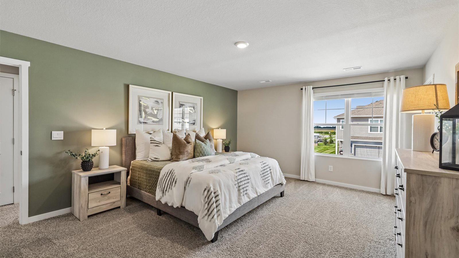 Primary bedroom with natural lighting and spacious layout