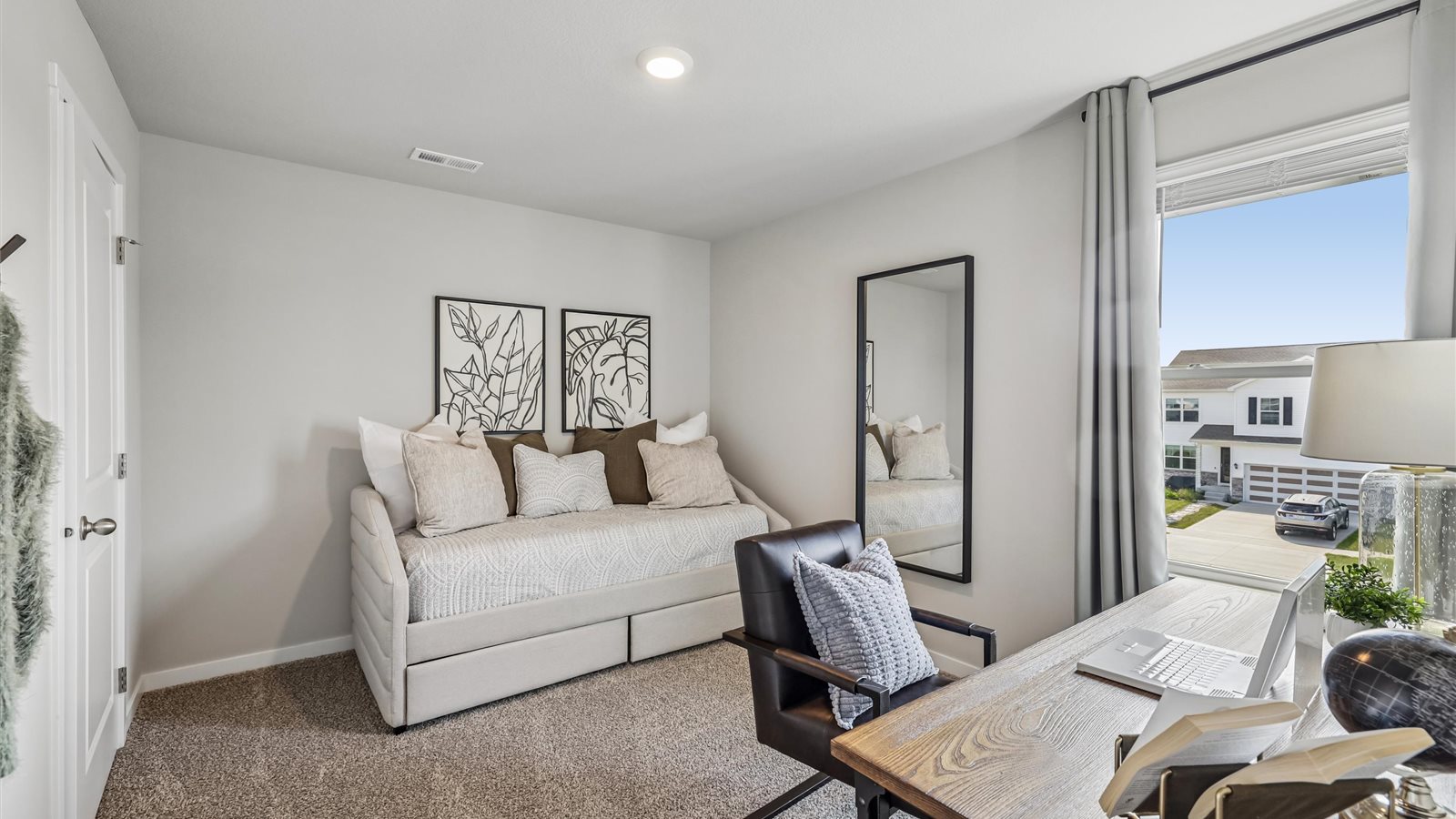 Comfortable secondary bedroom with natural light, modern finishes, and versatile living space.