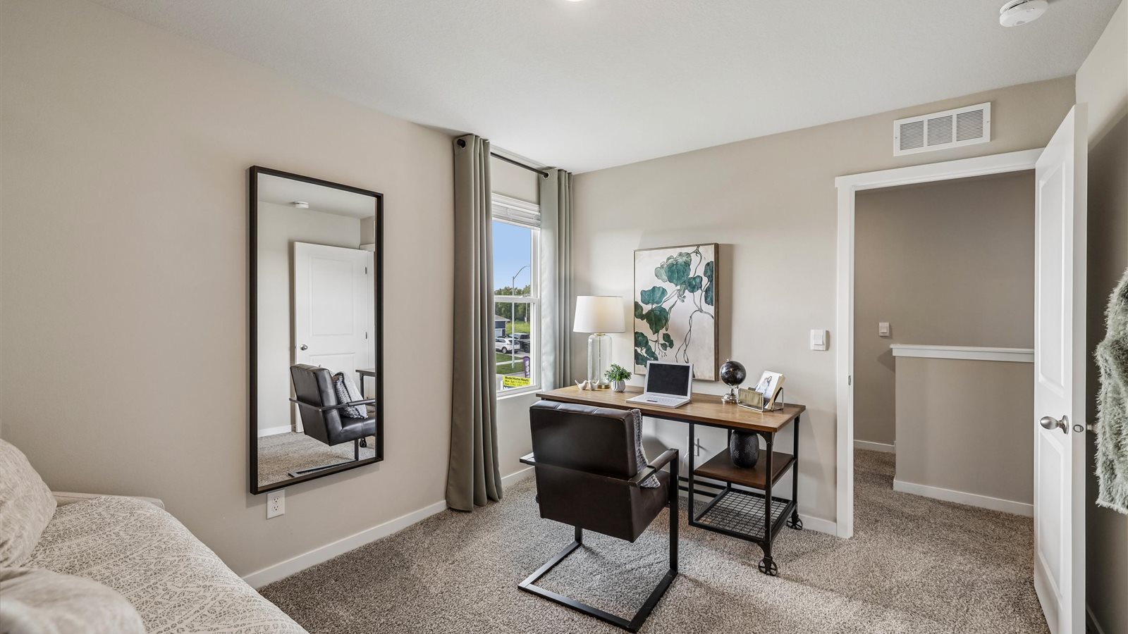 Comfortable secondary bedroom with natural light, modern finishes, and versatile living space.