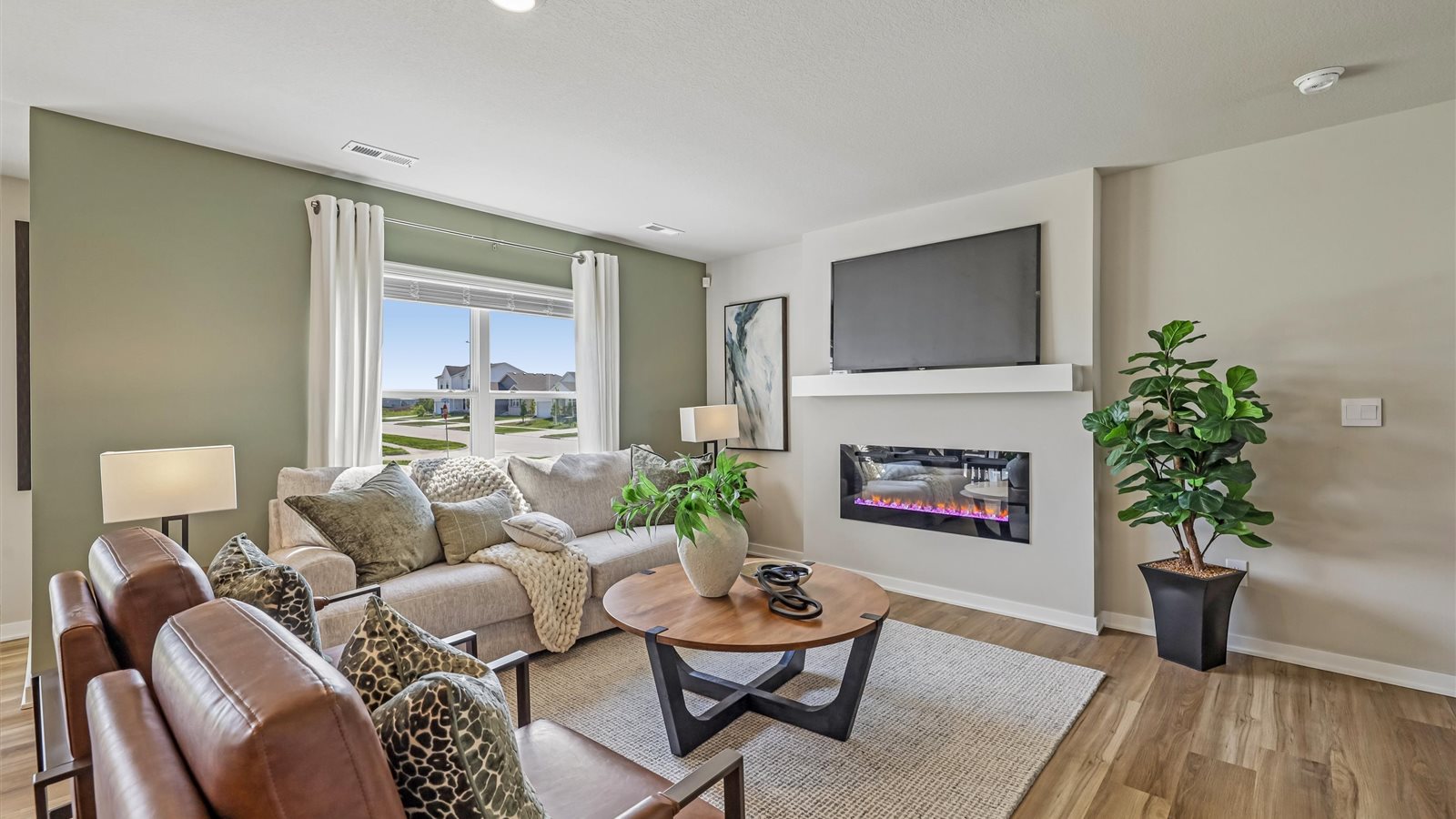 Open concept living room with electric fireplace